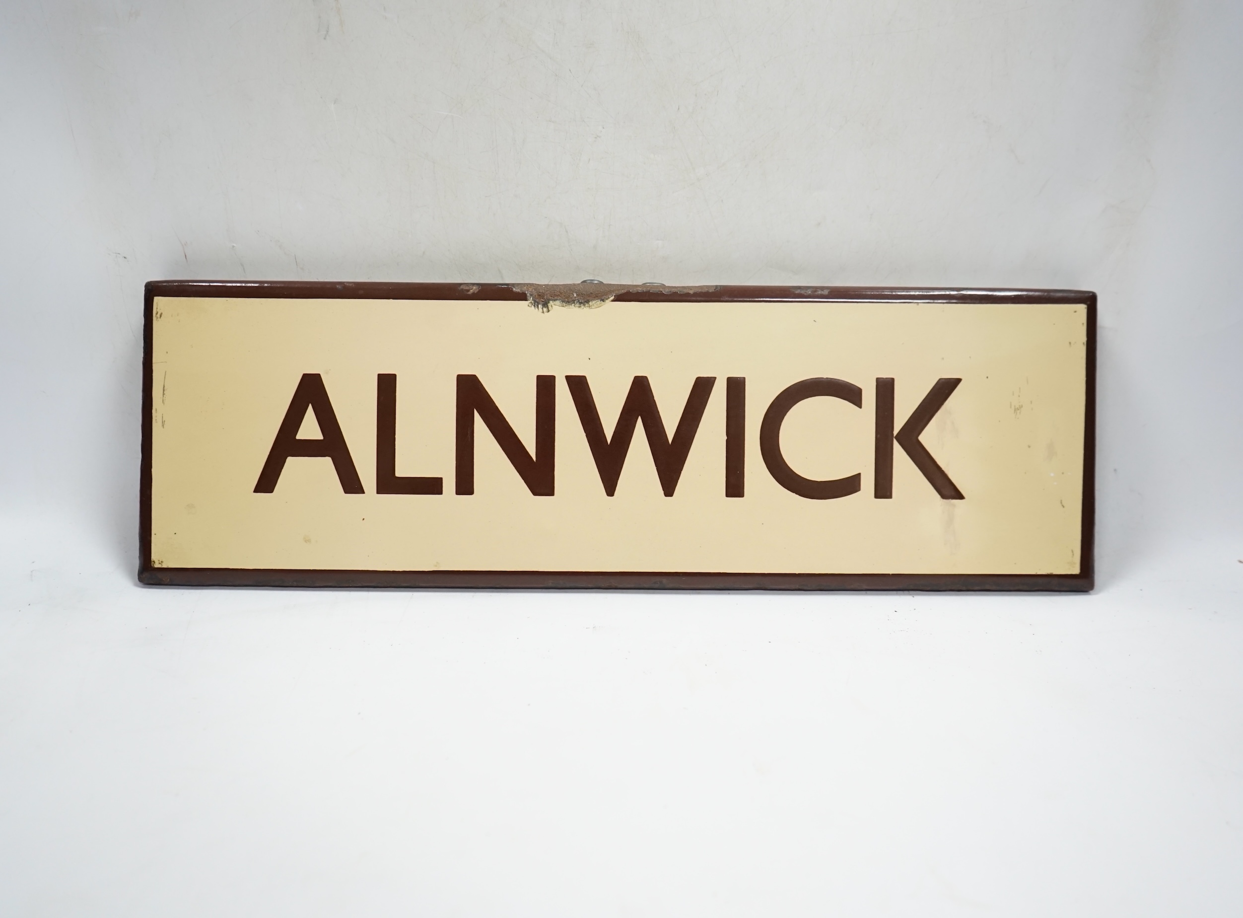 A London & North Eastern Railway enamel lamp tablet for Alnwick. Condition - fair to good.